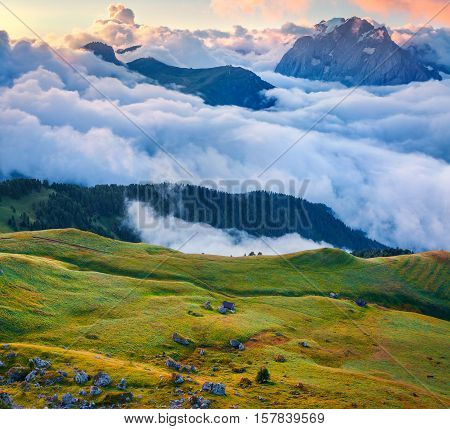 View Of The Foggy Val Di Fassa Valley With Passo Sella