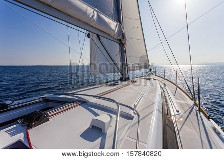 sail vessel surfing through the aegean sea