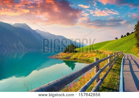 Bicycle Path Around Resia Lake In The Italian Alps.