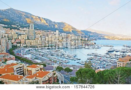 The nice view on the Hercules Port La Condamine and Monte Carlo wards surrounded by mountains from the viewpoint on the Rock of Monaco.