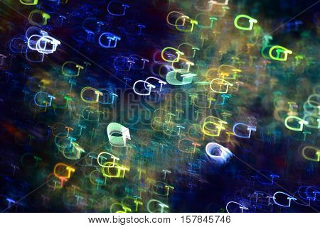 Photo by colored light lines in the shape of letters G to abstract background.