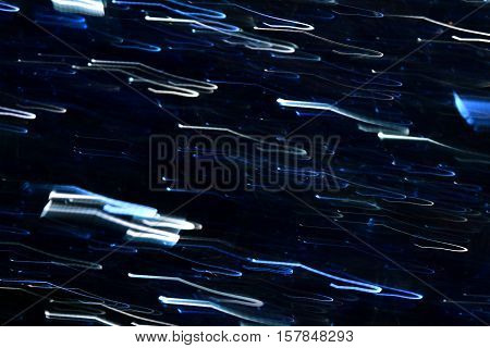 Photo by blue and white broken light traces to abstract background.
