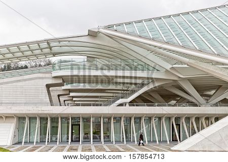 LIEGE BELGIUM - December 2014: Traveller walking in front of the Liege-Guillemins railway station designed by Santiago Calatrava.