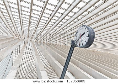 LIEGE BELGIUM - December 2014: Abstract view on the roof with station clock of the Liege-Guillemins railway station designed by Santiago Calatrava.