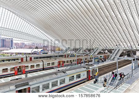 LIEGE BELGIUM - December 2014: Platform with people waiting for the train in the Liege-Guillemins railway station designed by Santiago Calatrava