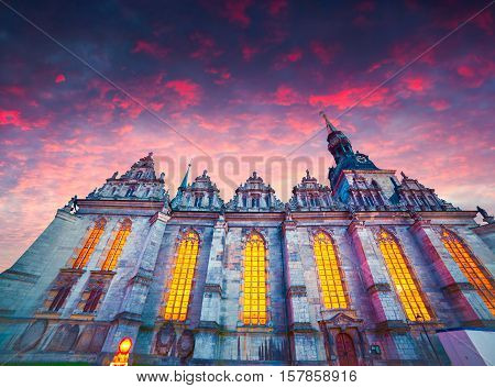Dramatic spring sunset in Wolfenbuttel village caled Little Venice. View of Holy Trinity Church in Wolfenbuttel Niedersachsen Germany Europe.