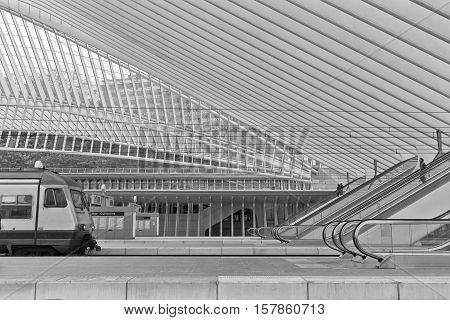 LIEGE BELGIUM - December 2014: View on escalators in the Liege-Guillemins railway station designed by Santiago Calatrava. Black and white photograph