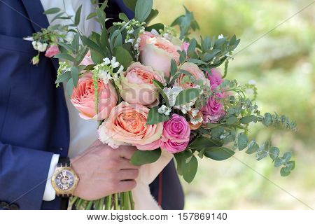 Groom Holding A Beautiful Bridal Bouquet. Wedding Bouquet Of Peach Roses By David Austin,  Single-he