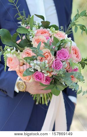 Groom Holding A Beautiful Bridal Bouquet. Wedding Bouquet Of Peach Roses By David Austin,  Single-he