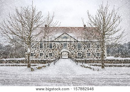 View of a snow covered Hovdala Castle in Hassleholm region. Hovdala Castle is a castle in Hassleholm Municipality Scania in southern Sweden.