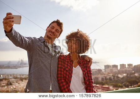Couple Pulling Faces To Take Selfies