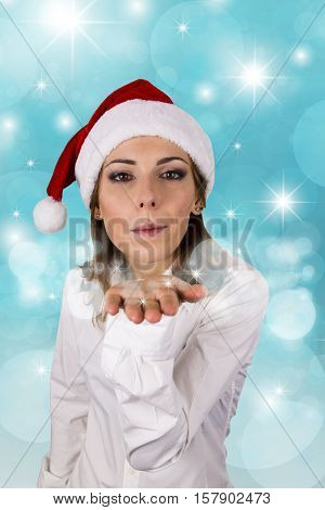 Christmas Woman. Beautiful fashion model with hat Santa Claus.