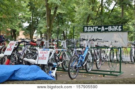 Vrnjacka Banja Serbia - August 23 2016: Parked colorful bicycles for a rent in a park