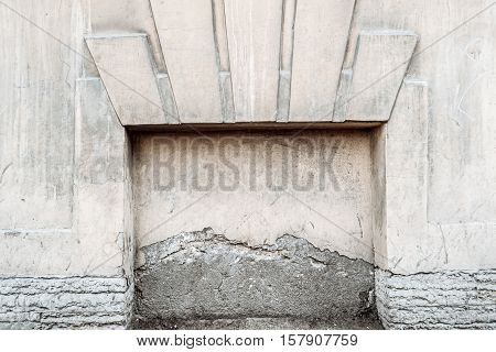 Decorative immured window of old building in St Petersburg Russia. We can see half destroyed plaster on. Frame for design, a lot of space for text.
