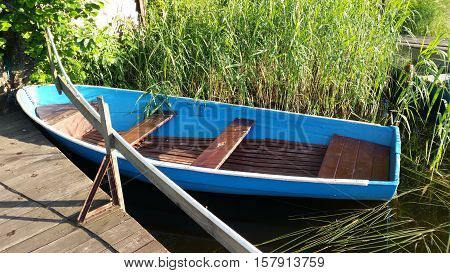 Beautiful lake boat. Camping Russia. Holidays in Sunny day on a quiet lake.