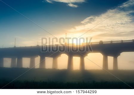Street bridge in the misty fog of the Trinity River Dallas Texas