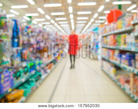 Blurred of kids toy department of store with unrecognizable customer as background