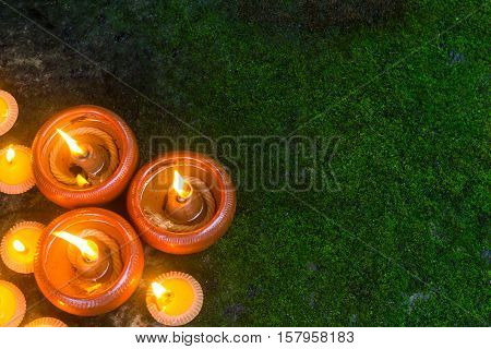 Orange Candle and beeswax warm light in dark