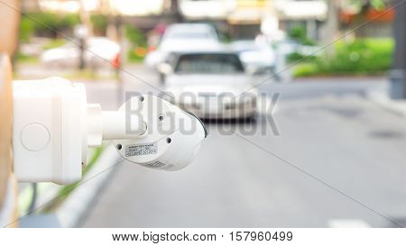 Security equipment concept - CCTV camera surveillance on car parking Safety system area control with flare light and copy space