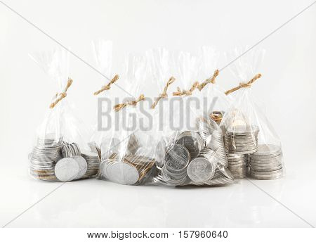 Financial saving and background concept - Close up bags of coins on white background for financial and saving artwork