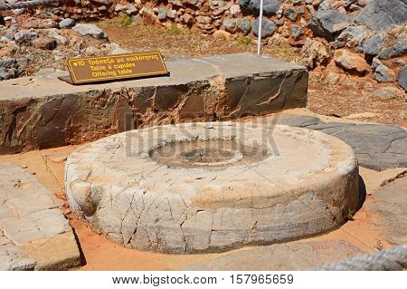 MALIA, CRETE - SEPTEMBER 14, 2016 - Ancient offering table at the Minoan Malia ruins archaeological site Malia Crete Greece Europe, September 14, 2016.
