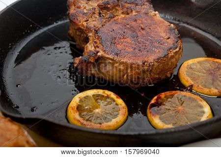 Pork Chop Seared On Iron Skillet