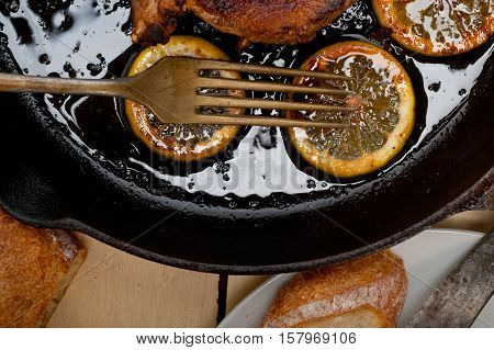 Pork Chop Seared On Iron Skillet