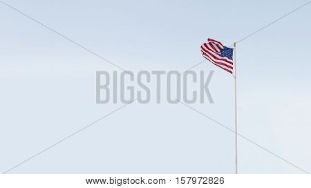 view of American flag on blue sky back. banner. lots of space for your text