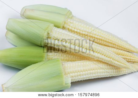 The heap of baby corn on white background