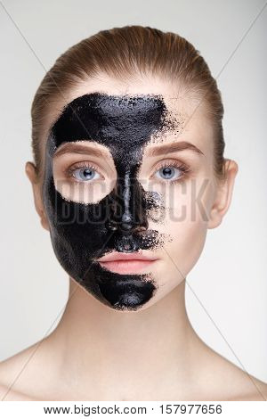 Beauty portrait young woman healthy skin care health white background smile healthcare treatment copy space black mask salve close up