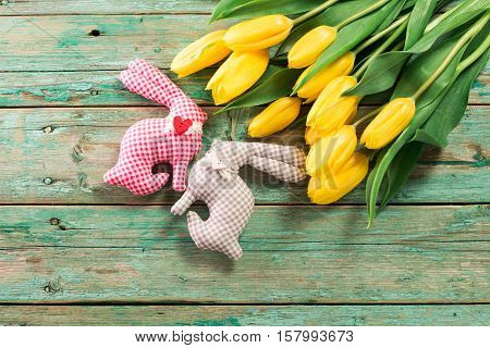 Easter Background Yellow Tulips On Wooden Table, Rabbit, Eggs,nest Candy