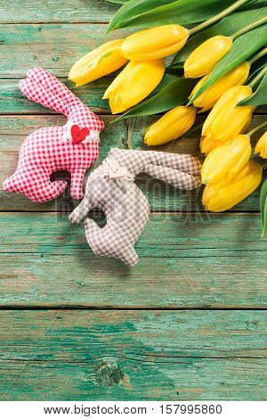 Easter Background Yellow Tulips On Wooden Table, Rabbit, Eggs,nest Candy