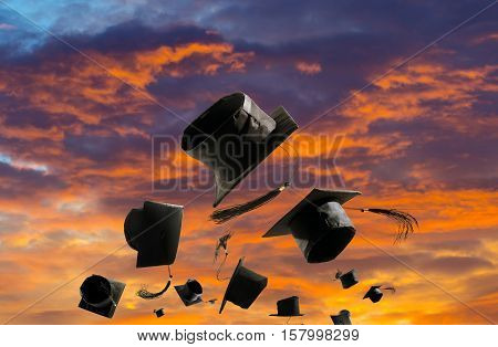 Graduation Ceremony, Graduation Caps, Hat Thrown In The Air Sunset Sky Abstract Backgrpund.
