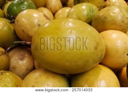 Bright Yellow, Delicious And Juicy Passionfruit. Heap Of Passion Fruit. Maracuya, Passiflora Edulis 