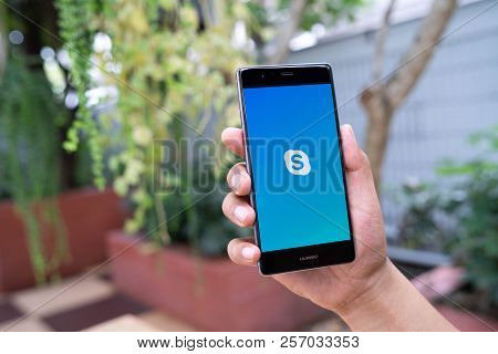 Chiang Mai, Thailand - August 05,2018: Man Holding Huawei With Skype Apps. Skype Is Part Of Microsof