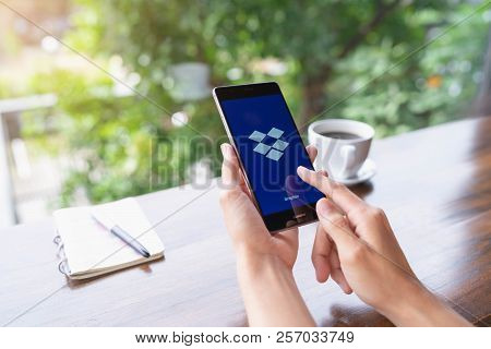 Chiang Mai, Thailand - August 18,2018: Woman Hands Holding Huawei With Dropbox On Screen. Dropbox Is