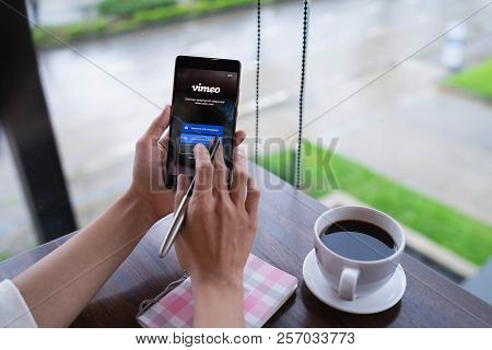 Chiang Mai, Thailand - August 18,2018: Woman Hands Holding Huawei With Vimeo On Screen.  Vimeo Is A 