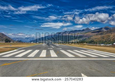Queenstown, New Zealand - January 19, 2018: Queenstown Airport Runway With Mountains In The Backgrou