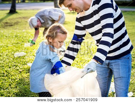 Kids picking up trash in the park