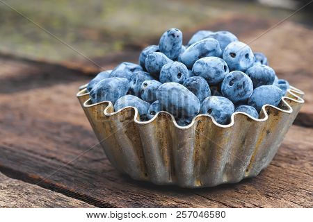 Summer Honeysuckle Berries In Metal Forms For Baking