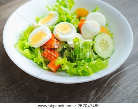 Healthy Bowl Of Homemade Salad With Fresh Vegetables, Crab Stick, Eggs