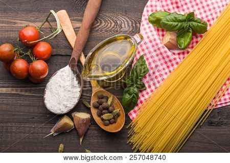 Food Background For Tasty Italian Dishes With Tomato. Various Cooking Ingredients With Spaghetti And