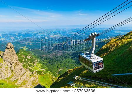 Cable Car On The Ropes, Going To Mount Kasprowy Wierch, Poland. Beautiful View Of The Valley