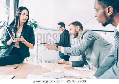 Multiracial Business Parters Having Conversation At Conference Hall