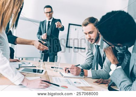 Multiracial Business Parters Having Conversation At Conference Hall