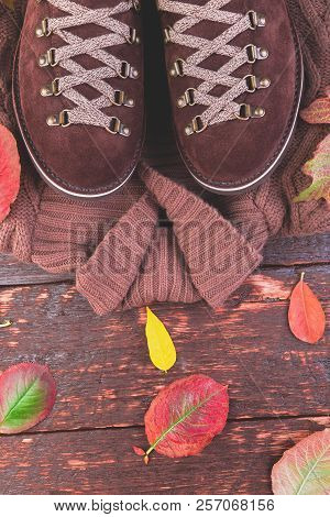 Brown Man Suede Boots With Sweater On Wooden Background