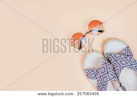 Summer Fashion Flatlay With Gradient Round Sunglasses And Espadrille Sandals On The Beige Background