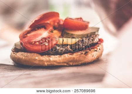 Cook Adding Tomato On Burger.preparing And Making Hamburger.