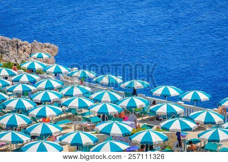 Santa Cesarea Terme, Italy, 18 July 2018 - Top Aerial View Of Beach Umbrellas In The Santa Cesarea T