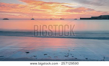 Eyemouth Beach At Sunrise In Scotland Using A Long Exposure